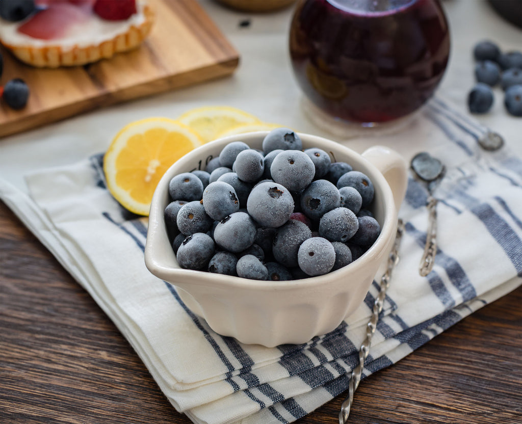 Frozen blueberries in a small cup